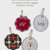 Set of personalized initials ornaments with brass keyrings for keys, luggage, backpacks, and bags in festive styles.