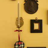 Custom embroidered pet ornament with plaid design and pet silhouette, personalized with pet name, hanging by a red ribbon