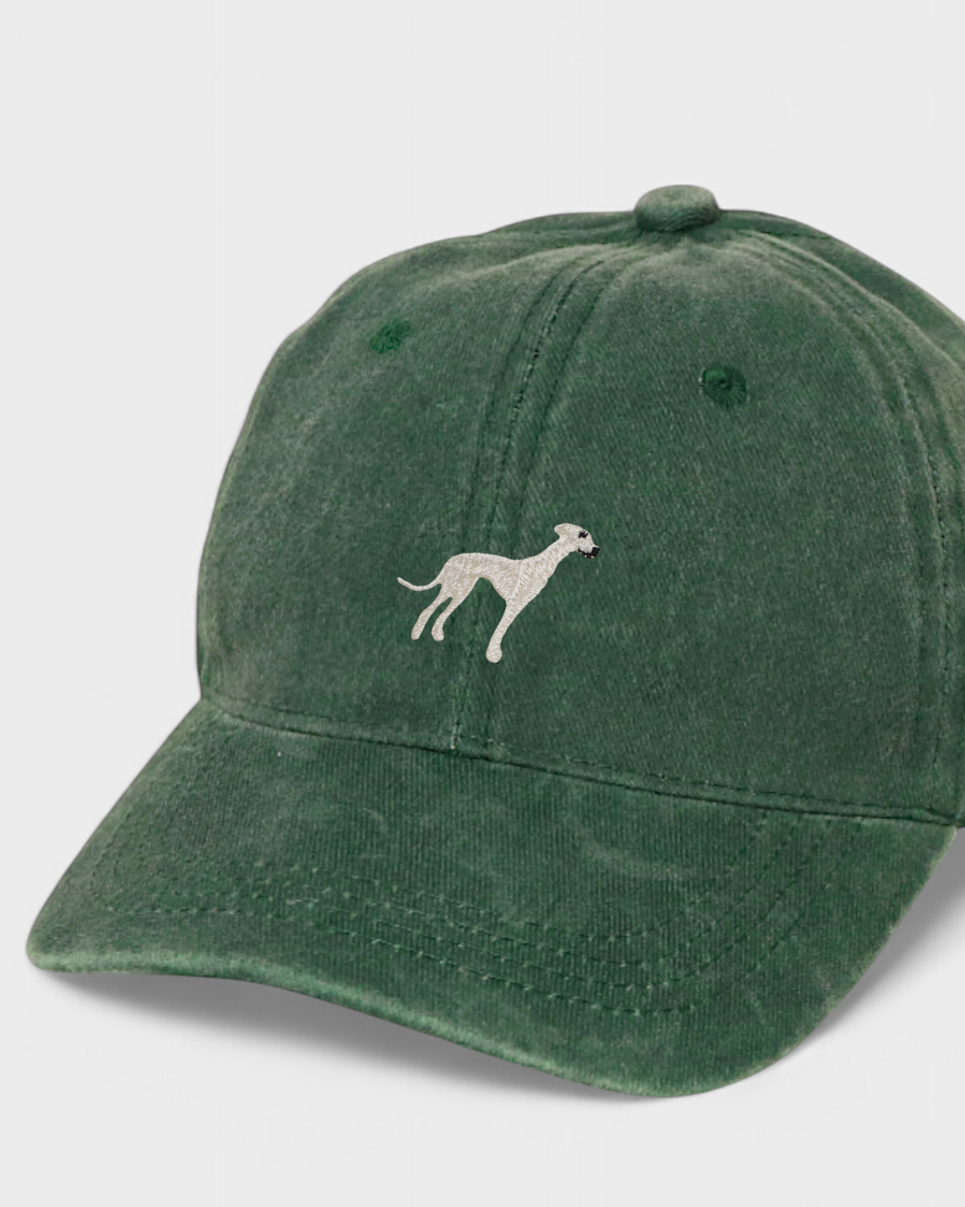 Green washed cotton baseball cap with hand-embroidered greyhound design and customizable back embroidery