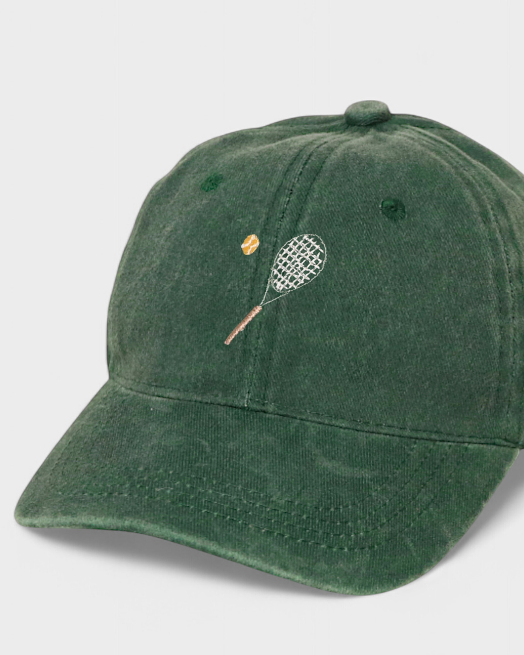 Tennis personalised hat with embroidered racket and ball design.