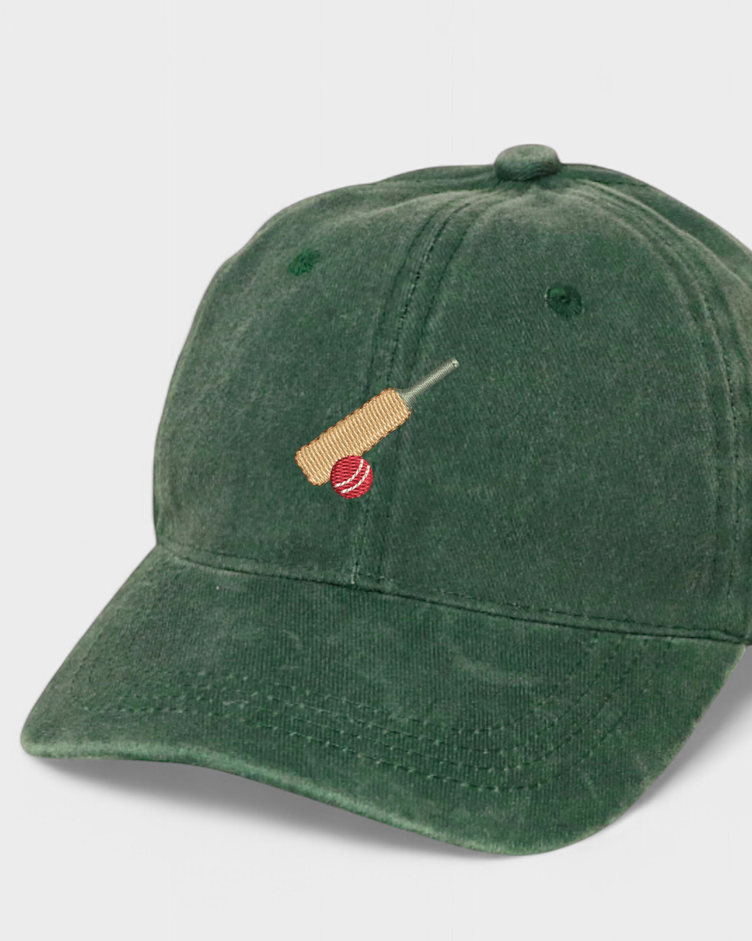 Cricket personalised hat with embroidered bat and ball design, made of 100% washed cotton.