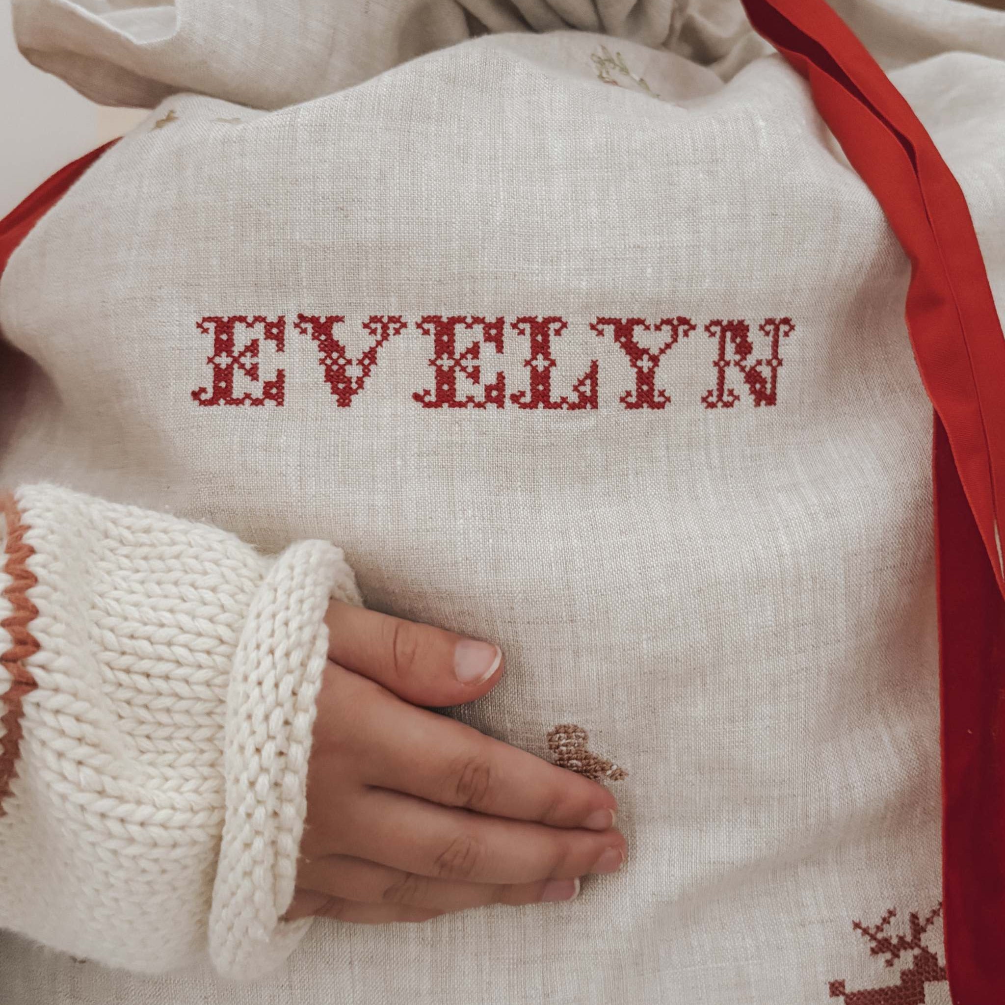 Personalized linen Santa sack with red embroidery and festive motifs