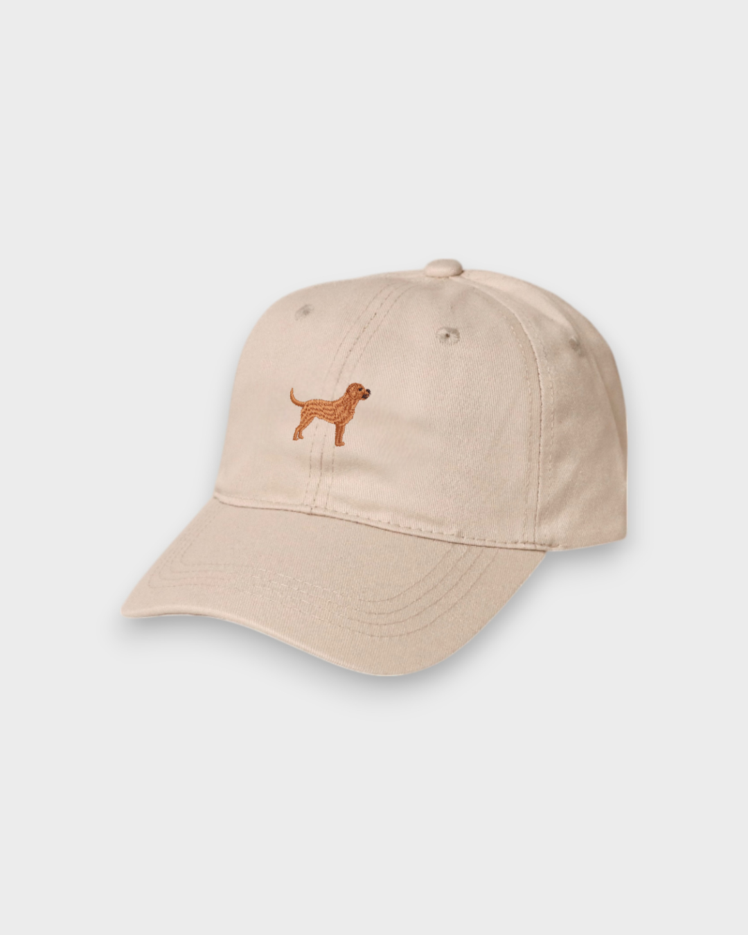 Beige personalised hat with hand-embroidered Labrador design on front, made of 100% washed cotton in classic baseball style