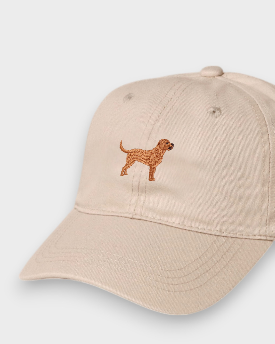 Beige personalised baseball hat with embroidered hand-drawn Labrador design on front