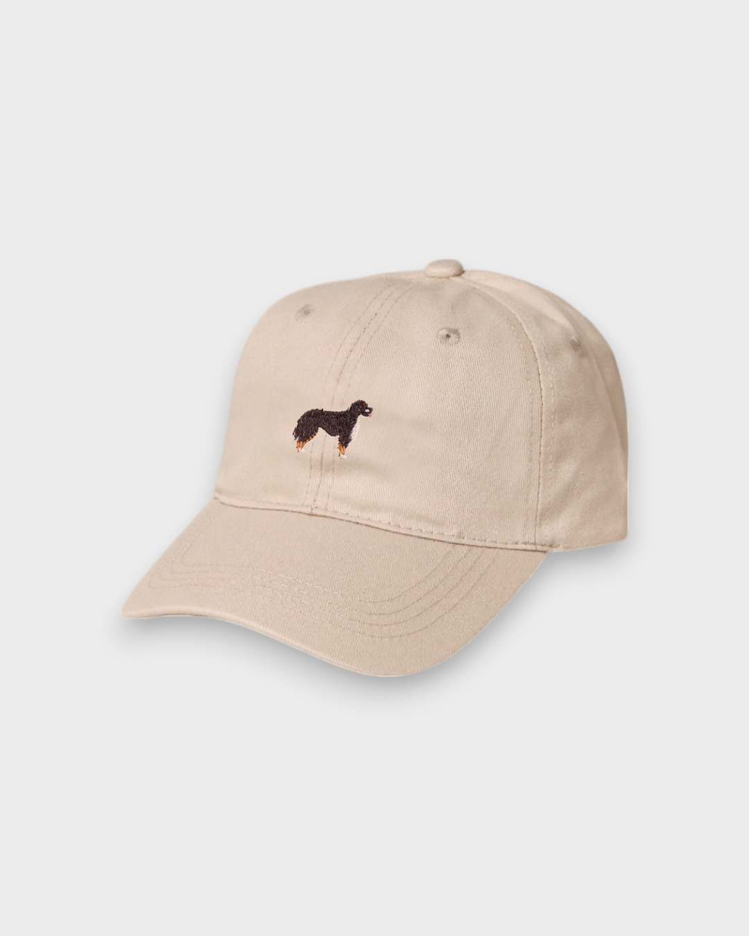 Beige baseball cap with embroidered Burmese Mountain Dog design on the front, personalised hat made of 100% washed cotton.
