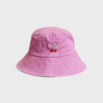 Pink bucket hat with cherries embroidery designed for kids aged 2-6.