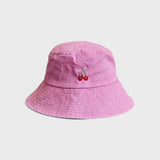 Pink bucket hat with cherries embroidery designed for kids aged 2-6.