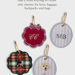 Set of personalized initials ornaments with brass keyrings for keys, luggage, backpacks, and bags in festive styles.