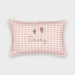 Pink gingham linen cushion with embroidered hot air balloons and personalized name "Daisy"