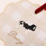 Personalised initials ornament with embroidered dog design and red velvet ribbon for holiday decor