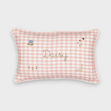 Botanical linen cushion with pink gingham pattern, hand-embroidered floral designs, and personalized name embroidery