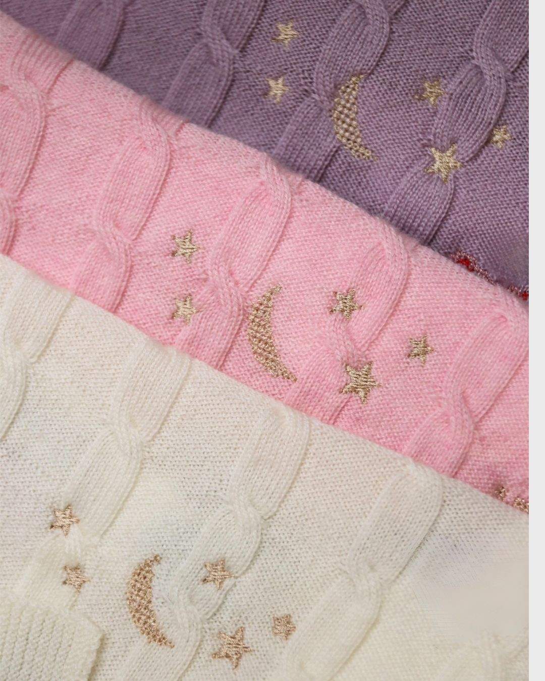 Merino baby blanket with moon and stars design, embroidered details on soft, breathable wool.