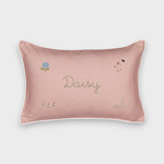 Pink botanical linen cushion with embroidered floral designs and personalized name "Daisy"