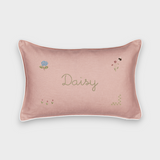 Pink botanical linen cushion with embroidered floral designs and personalized name "Daisy"