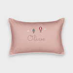 Pink linen up and away cushion with embroidered vintage hot air balloons and personalized name "Olive" with white piping border