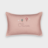 Pink linen up and away cushion with embroidered vintage hot air balloons and personalized name "Olive" with white piping border