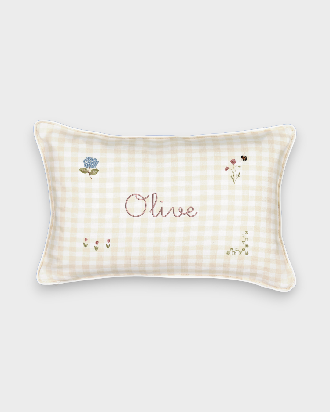 Botanical Linen Cushion with hand-embroidered floral designs and personalised name on beige check linen fabric with white piping.