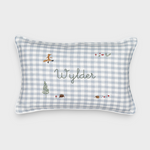 Rectangular Woodland Keepsake Linen Cushion with blue and white check pattern, embroidered with personalized name "Wylder" and small woodland animal and nature designs.