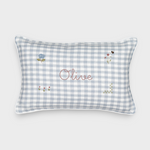 Botanical linen cushion with blue gingham pattern, hand-drawn floral embroidery, and personalized name "Olive" on front
