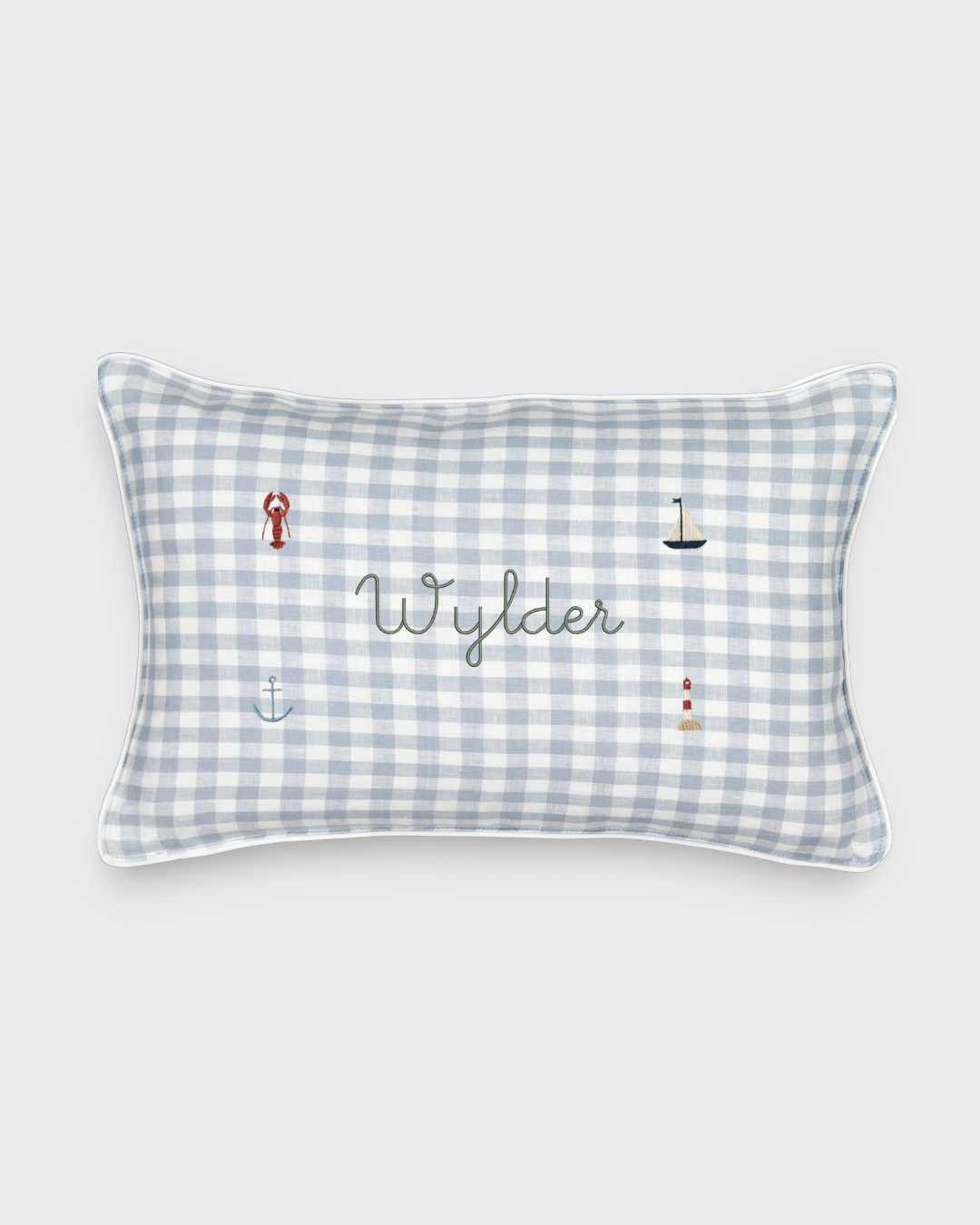 Duck egg blue gingham linen nautical cushion with embroidered sea-themed designs and personalized name Wylder