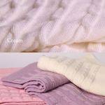 Merino baby blanket with moon and stars design in cream, pink, and purple colors.