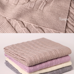 Merino baby blanket with moon and stars design, showcasing soft, breathable natural fibers in taupe, lilac, cream, and grey.