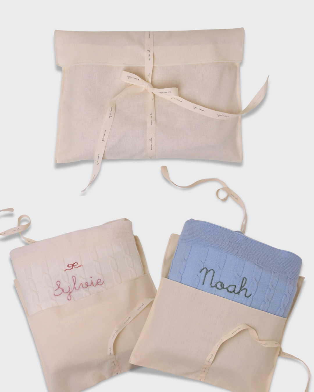 Merino baby blanket with moon and stars design, soft wool with personalized embroidery, gift set in fabric pouches.