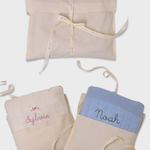 Merino baby blanket with moon and stars design, soft wool with personalized embroidery, gift set in fabric pouches.