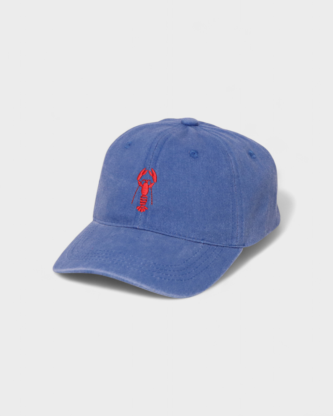 Blue washed cotton baseball cap with red hand-drawn lobster embroidery on the front, featuring personalized text option on the back.