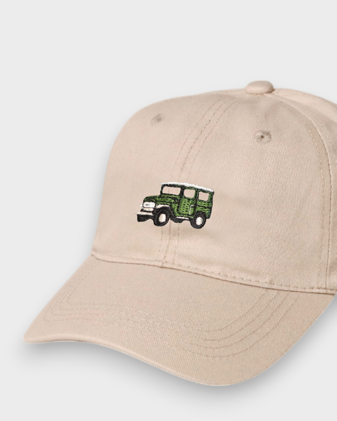 Beige personalised hat with embroidered green Land Cruiser FJ40 design on front made of vintage washed cotton