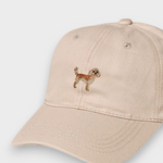 Beige Cavoodle personalised hat with hand-embroidered Cavoodle design on front made of 100% washed cotton.
