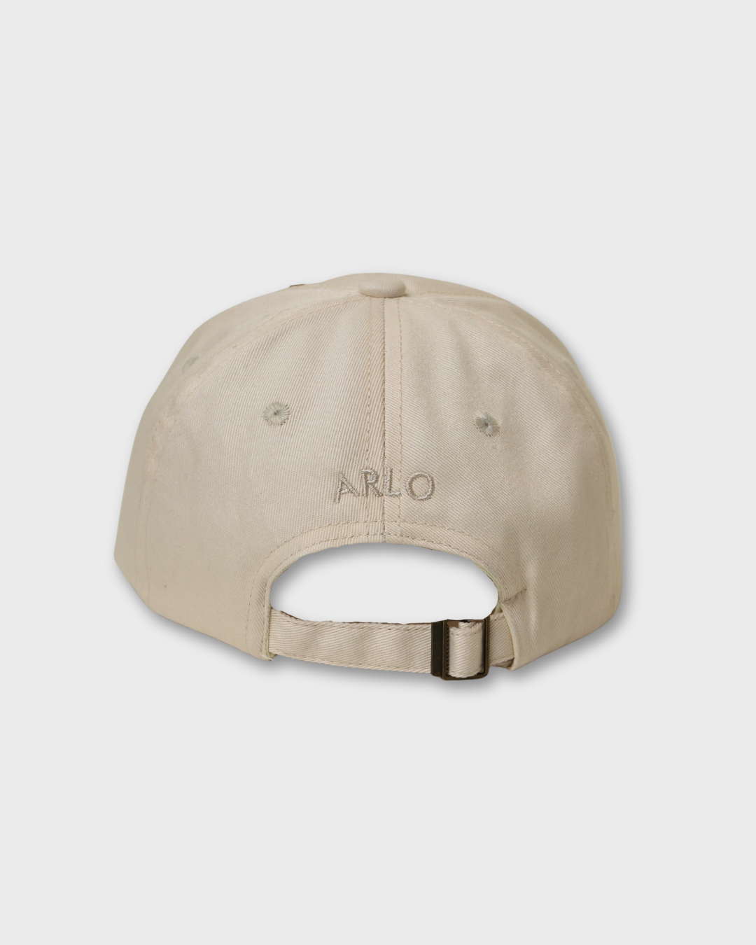 Beige airplane personalised hat with adjustable strap and embroidered name "ARLO" on the back