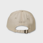 Beige personalised Hole In 1 embroidered hat with adjustable strap and custom name on back in washed cotton baseball style