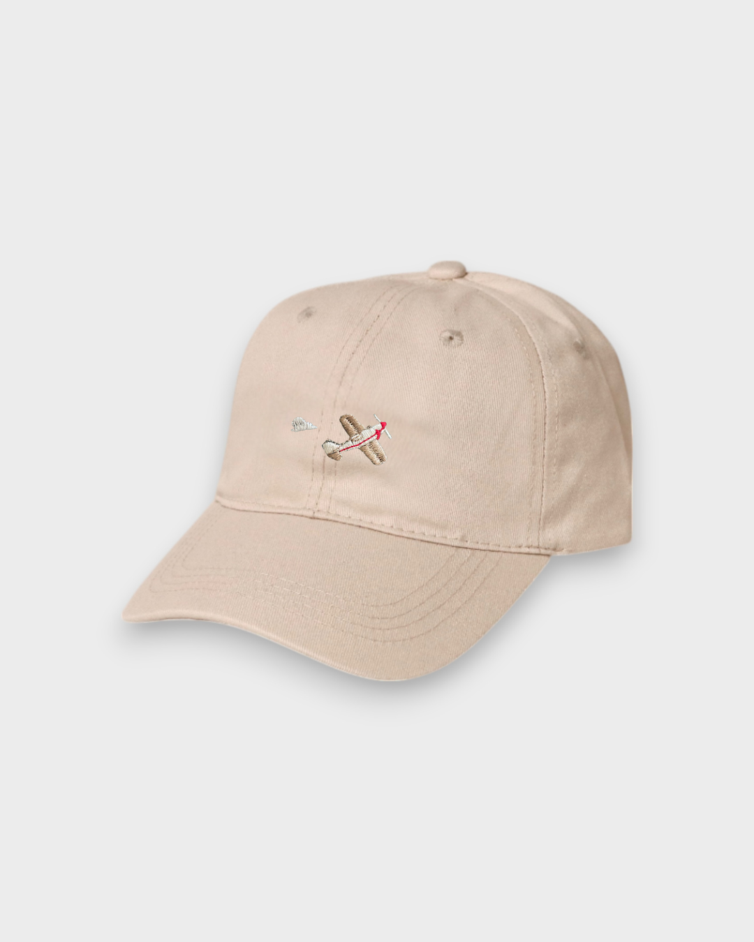 Beige airplane personalised hat with embroidered vintage plane design on front, made of 100% washed cotton in classic baseball fit.