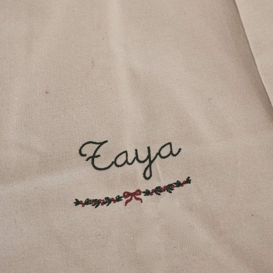 Personalised cotton canvas Santa Sack with embroidered name and festive garland design