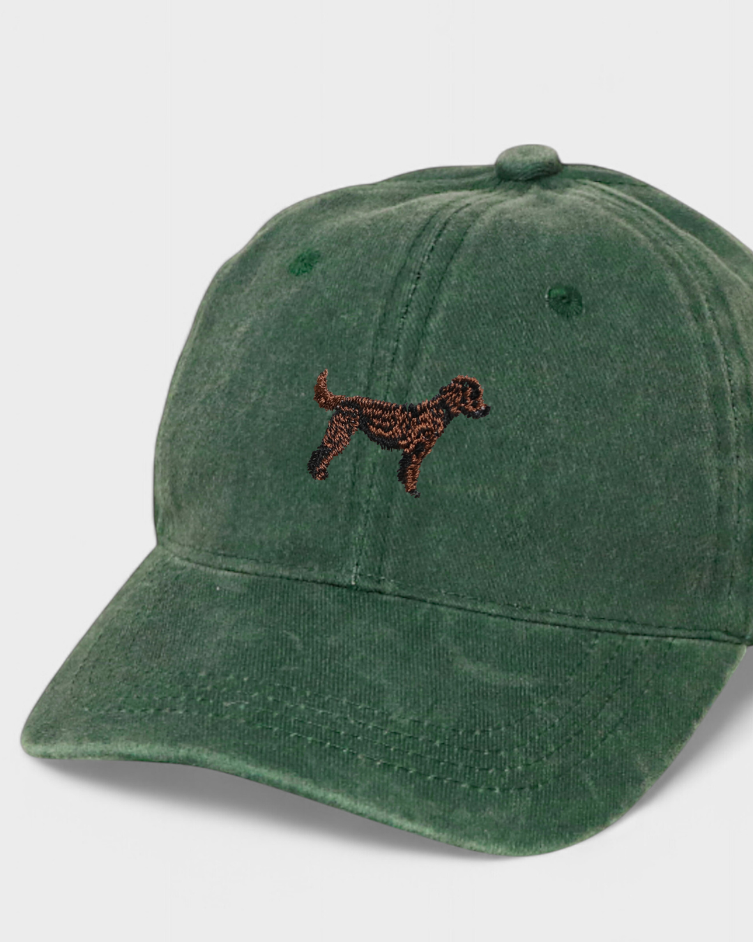 Green Labradoodle personalised hat with embroidered dog design on front, made of 100% washed cotton in classic baseball style