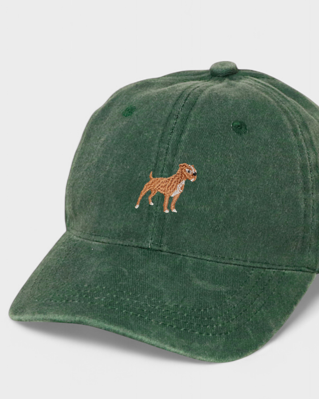 Dark green washed cotton baseball hat with embroidered Staffordshire Bull Terrier design on the front.