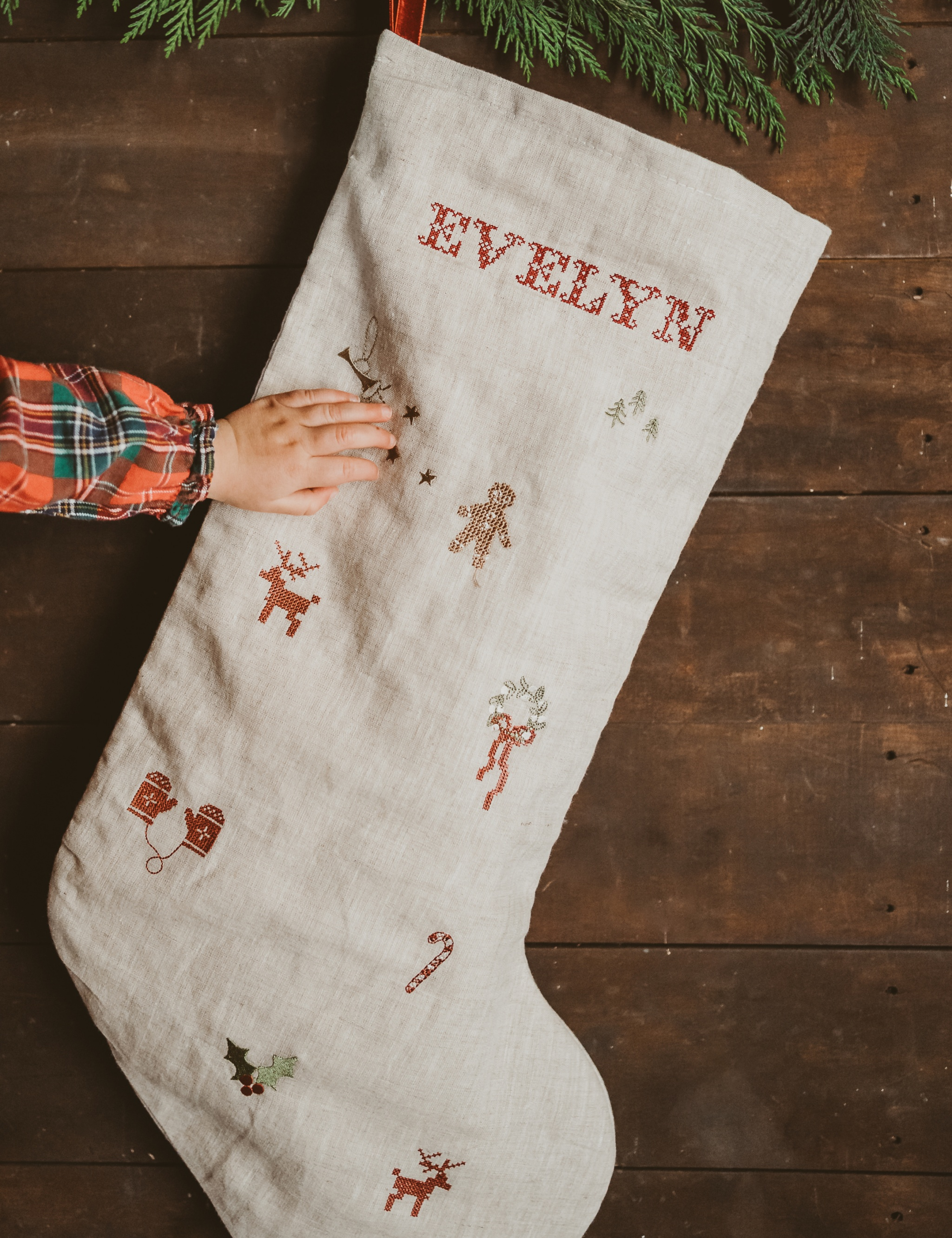 Natural linen stocking with holiday embroidery and personalized name Evelyn