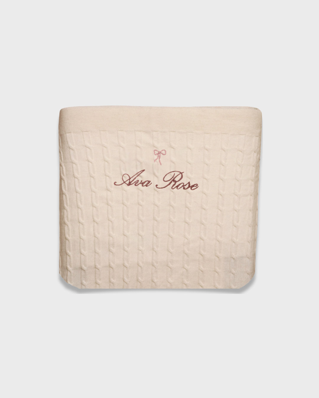 Merino baby blanket with embroidered bow and personalized name in soft cream wool
