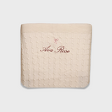 Merino baby blanket with embroidered bow and personalized name in soft cream wool