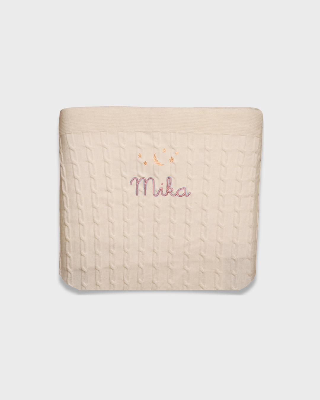 Cream merino baby blanket with embroidered moon, stars, and personalized name Mika