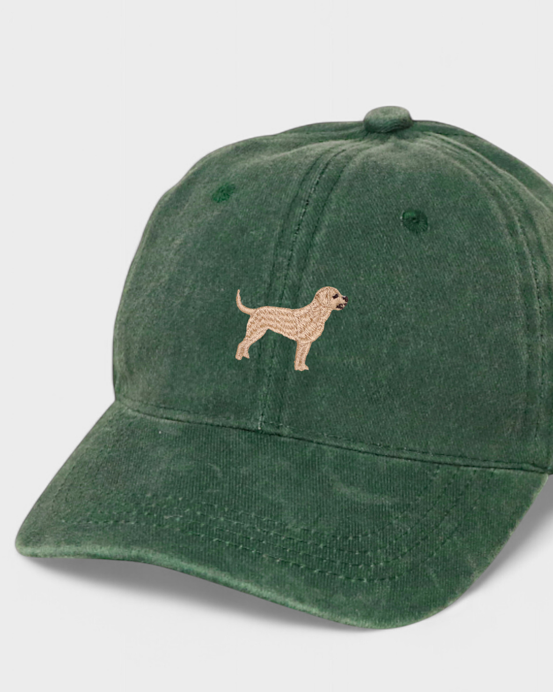 Green baseball cap with embroidered Labrador design; personalized back embroidery option.
