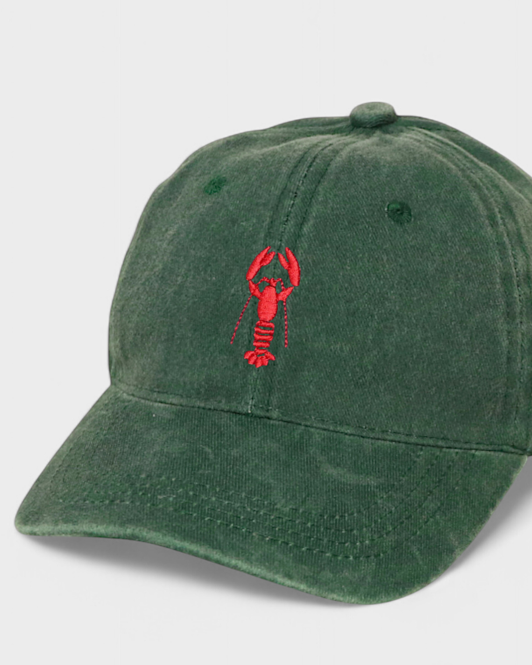 Green baseball cap with red lobster embroidery and personalized text option.
