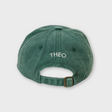 Green Hole In 1 personalised hat with adjustable strap and embroidered name Theo on the back