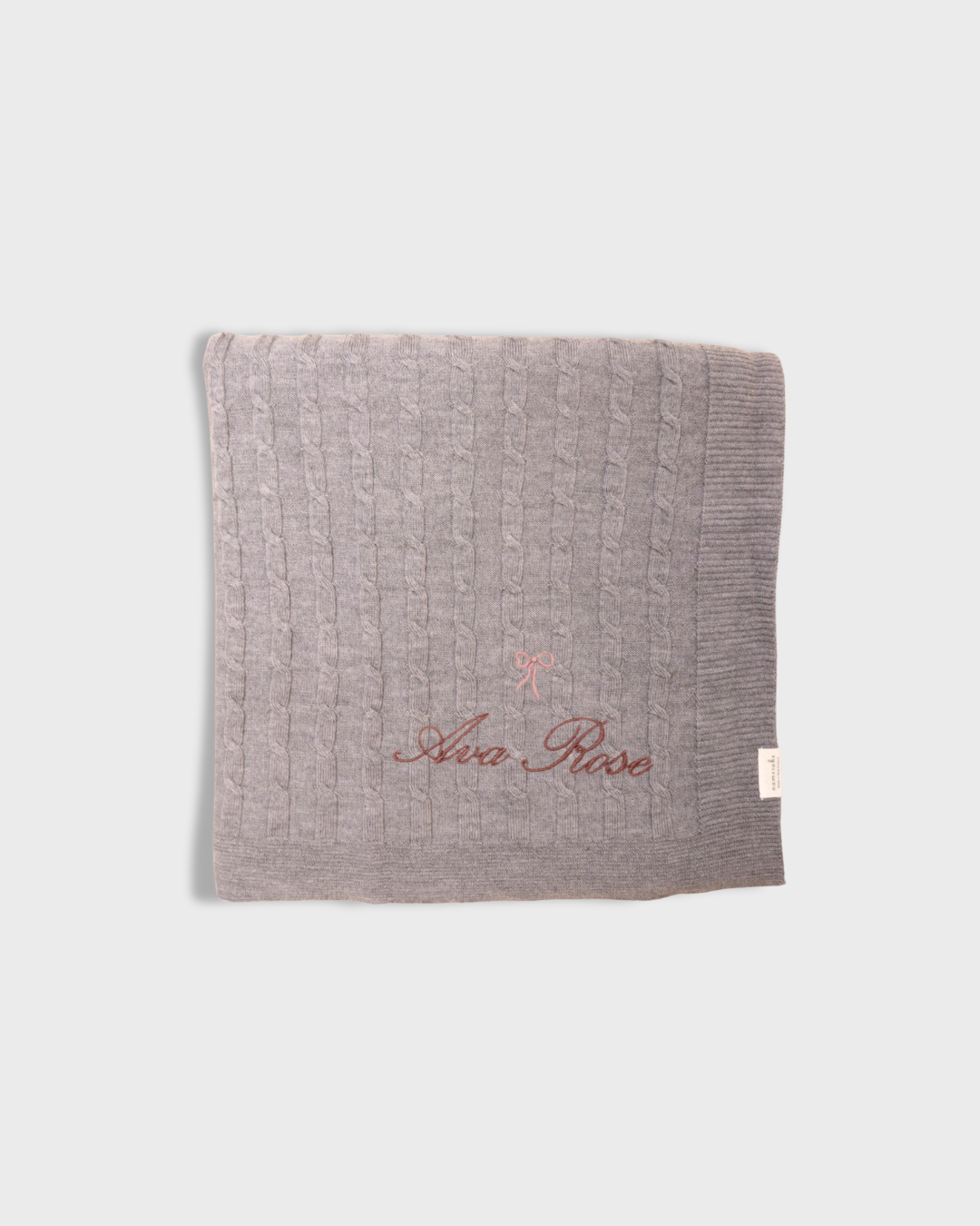 grey merino baby blanket with embroidered vintage bow and personalized name