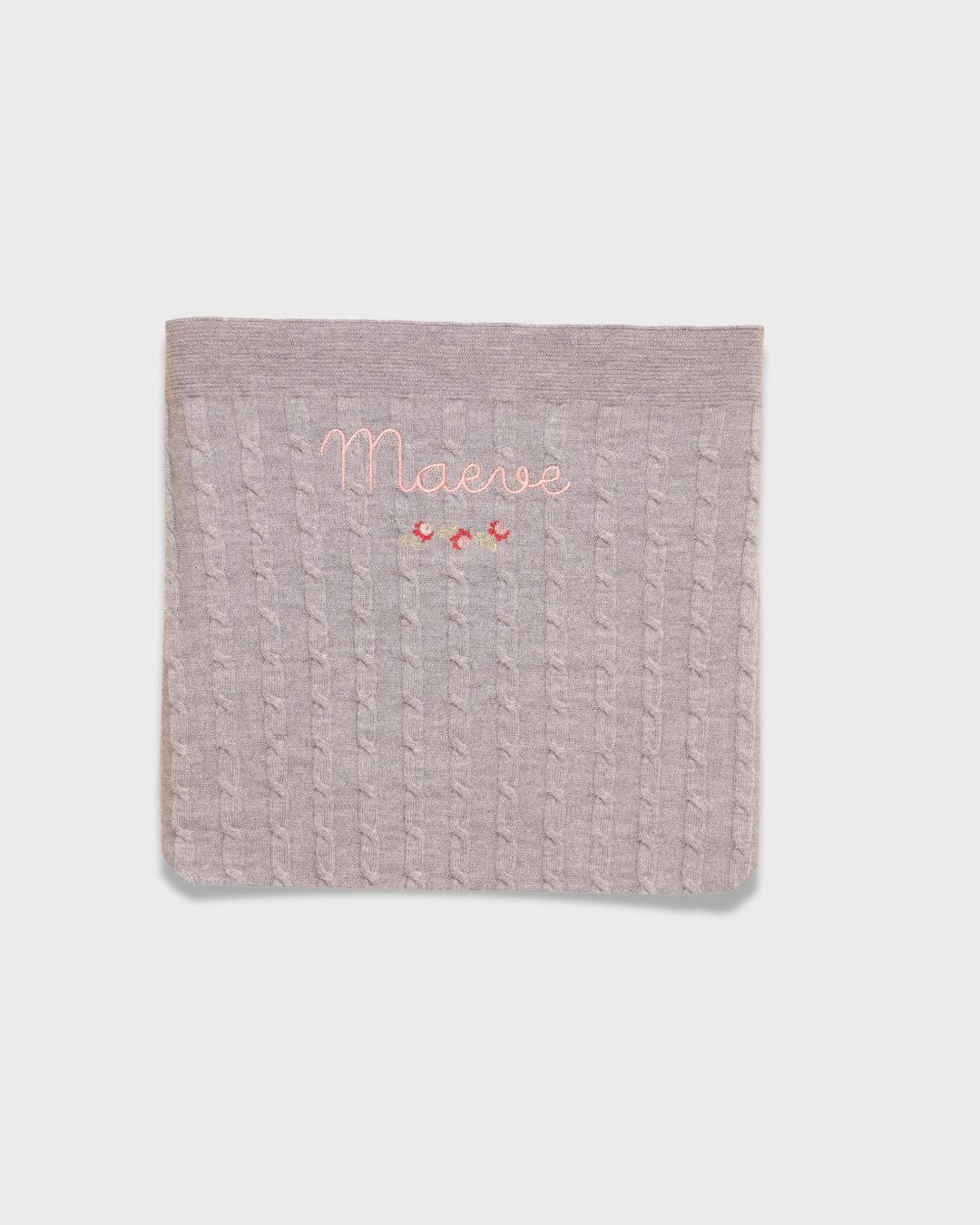 Merino baby blanket with rosette embroidery and personalized name in soft wool fibers