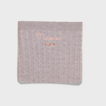 Merino baby blanket with rosette embroidery and personalized name in soft wool fibers