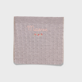 Merino baby blanket with rosette embroidery and personalized name in soft wool fibers