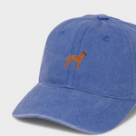 Blue baseball cap with embroidered hand-drawn Vizsla dog design on the front, made of 100% washed cotton.
