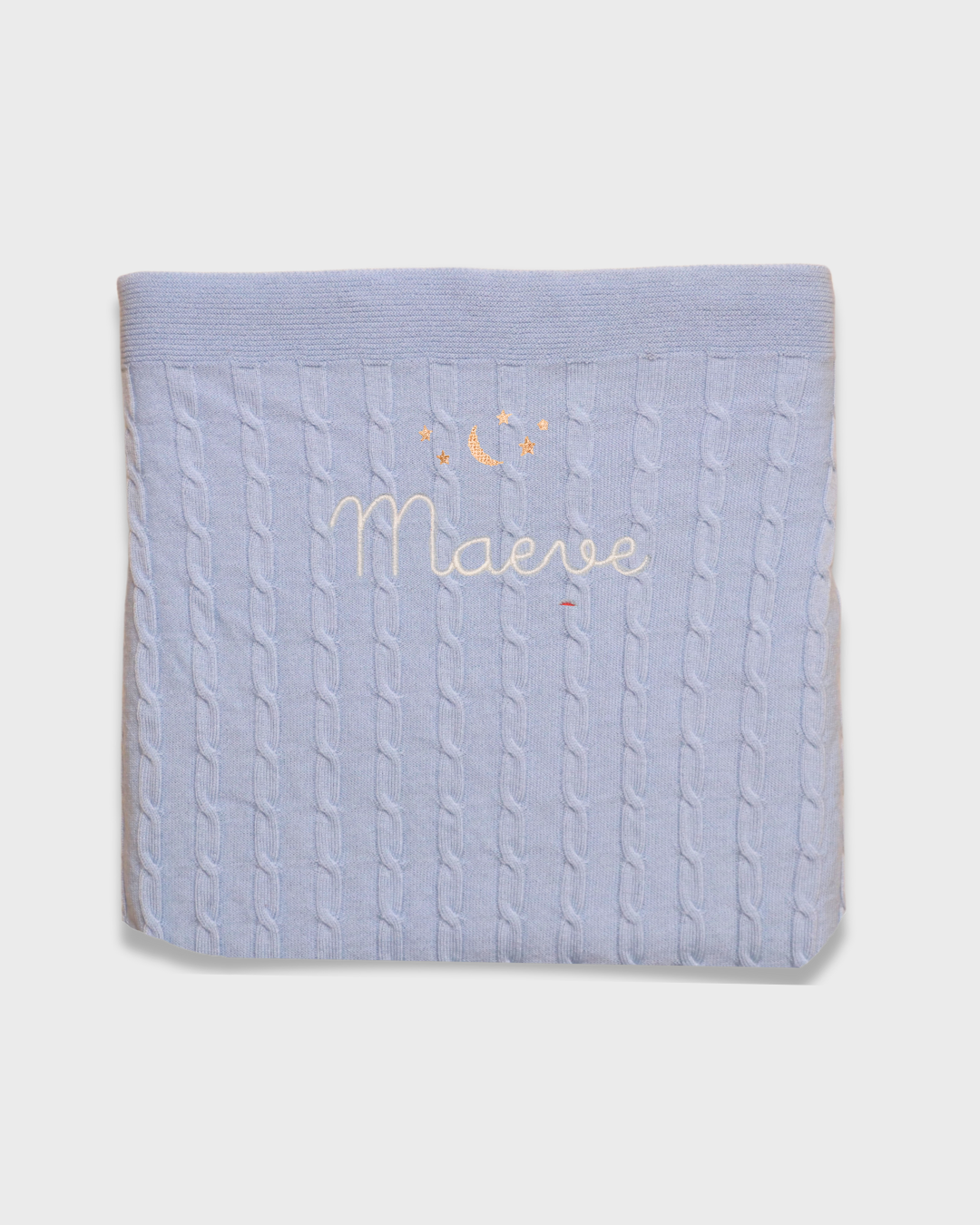 Merino baby blanket with moon and stars design embroidered in soft wool.
